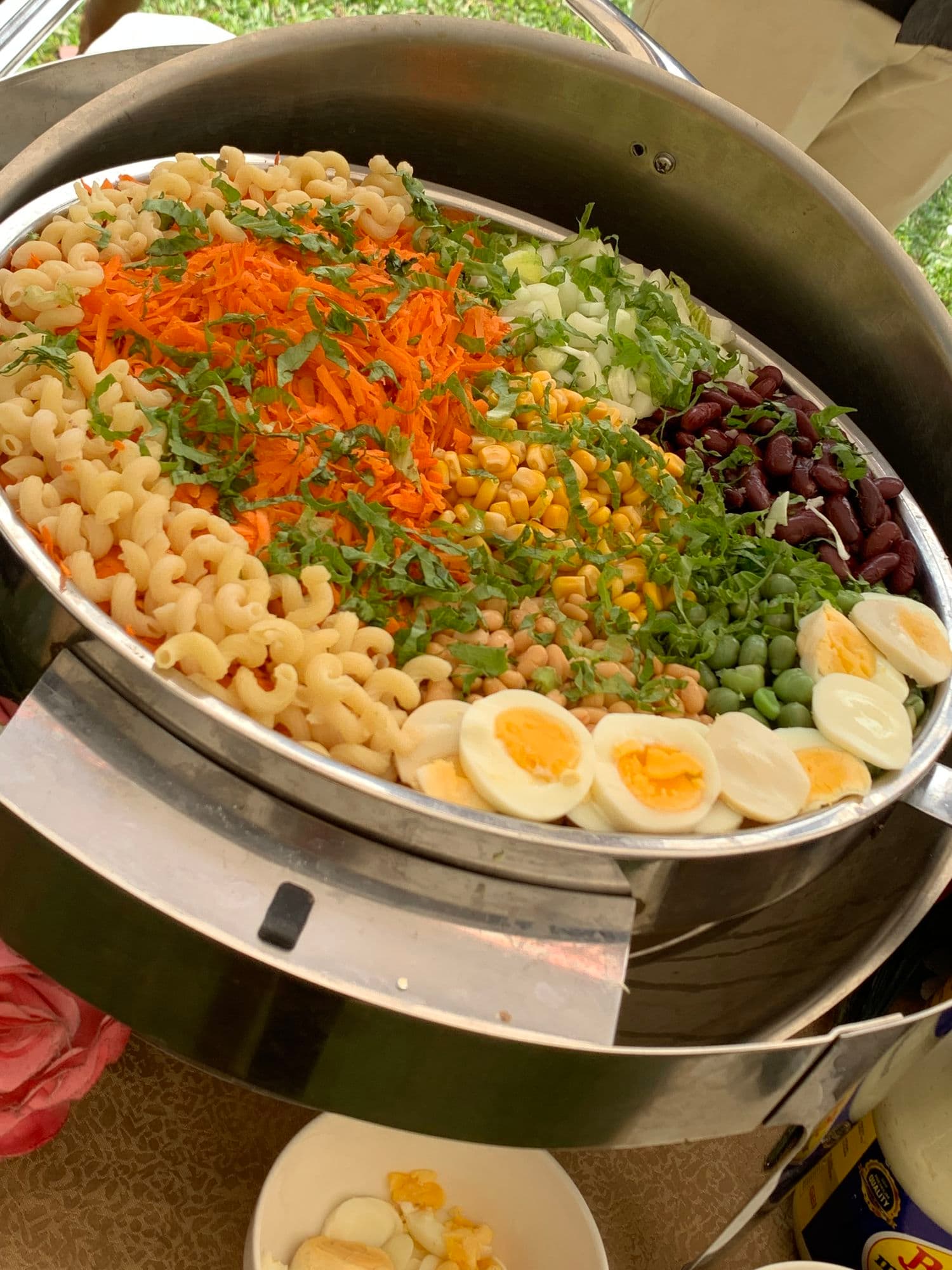 Pasta salad with carrots, sweetcorn, beans and boiled eggs