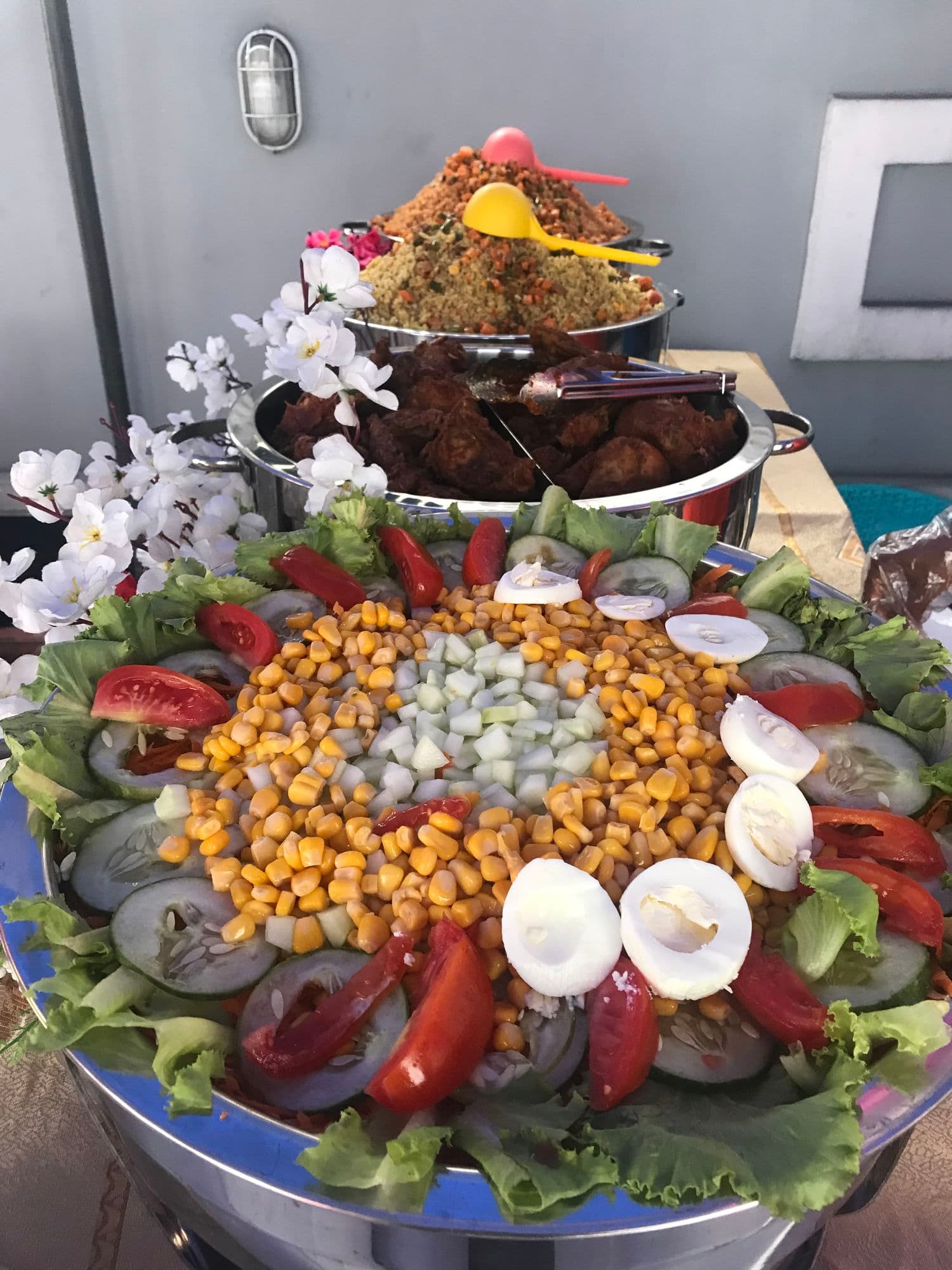 A colourful salad platter with sweetcorn, boiled eggs, tomatoes and lettuce
