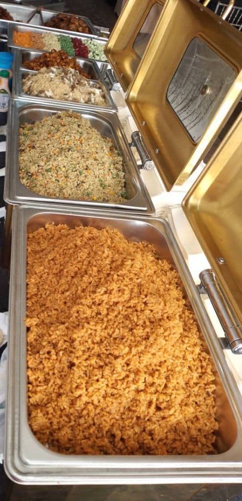Trays of jollof rice and fried rice